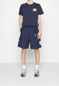 Tommy Jeans Triko s potiskem - dark blue