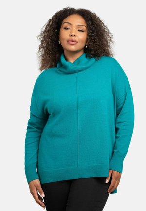 Teal turtleneck sweater med en afslappet pasform, ribbet halsudskæring og split i kanten. Lavet af blødt stof med en glat tekstur.