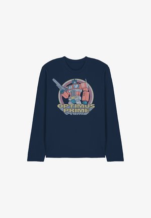 Marineblaues Langarmshirt mit einer Grafik von Optimus Prime, der eine Waffe hält, vor einem Kreis-Hintergrund, mit dem Schriftzug "Optimus Prime" darunter.