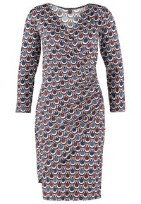 Viskosklänning i burgundy, marinblå och krämfärgad med ett cirkulärt mönster. Långa ärmar och rynkad söm på sidan. Mjuk, elastisk tyg.