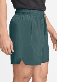 Jordan Korte sportsbukser - oxidized green
