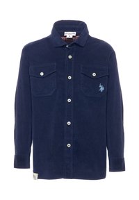 Camicia in velluto a coste blu navy con maniche lunghe, due tasche sul petto, bottoni bianchi e un piccolo logo ricamato blu sulla tasca sinistra.