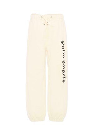 Pantaloni della tuta color crema con fascia elastica in vita e polsini, con testo "Palm Angels" in stile gotico nero disposto verticalmente lungo la gamba sinistra.