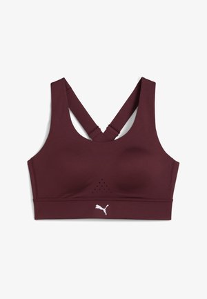 Maroon sports bra with a rounded neckline, crossback straps, and breathable mesh detailing. Features a white logo at the hem.