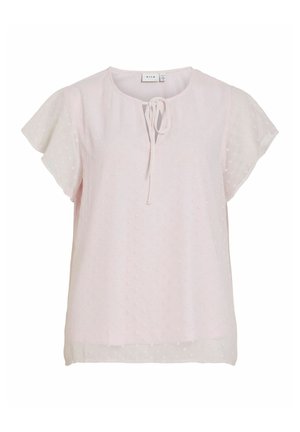 Blouse courte à manches courtes rose clair avec une texture subtilement ponctuée, encolure ronde et détail noué à l'avant.