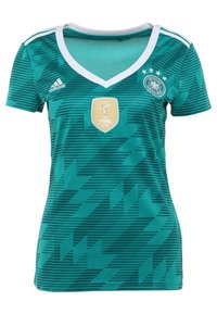 Vihreä ja musta kuviollinen urheilu paita, lyhyet hihat, V-kaula-aukko, jossa on FIFA World Cup 2014 -logo ja neljä tähteä rinnassa.