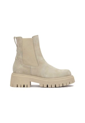 Stivaletto beige in suede con pannelli elastici laterali, punta arrotondata e suola in gomma spessa con scanalature profonde per una migliore aderenza.