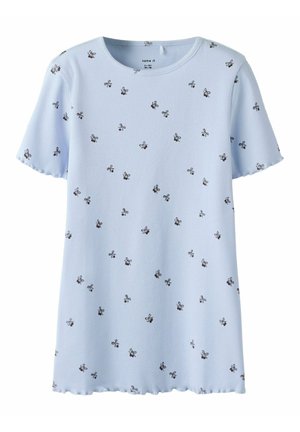Light blue ribbed t-shirt with short sleeves, featuring small black floral patterns and a scalloped hemline.