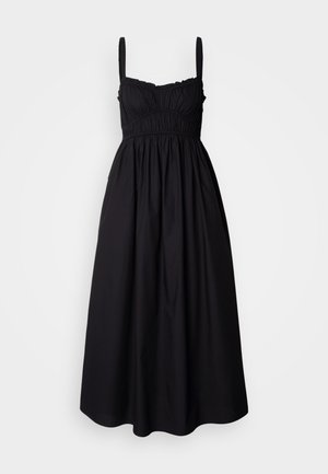 Black sleeveless dress with gathered bodice, elastic waist, and flowing skirt. Made of lightweight fabric with a smooth texture.
