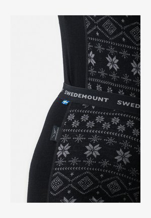 Sorte termoleggings med et geometrisk snefnugmønster i grå, med en SWEDEMOUNT talje og logoetiket.