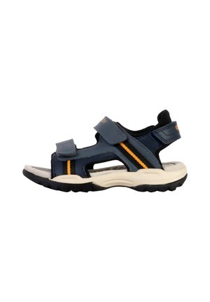 Mørkeblå børnesandal med lukket tå, justerbare velcroremme, orange detaljer og en let gummisål med tekstureret grip.