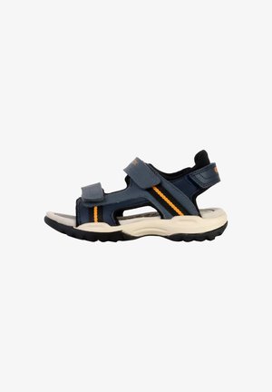 Navy blue children’s sandal with a closed toe, adjustable Velcro straps, orange accents, and a light rubber sole featuring a textured grip.