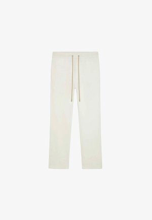 Pantalon de survêtement blanc avec cordon de serrage, coupe droite, taille élastique et cordons beiges, présenté sur un fond blanc uni.