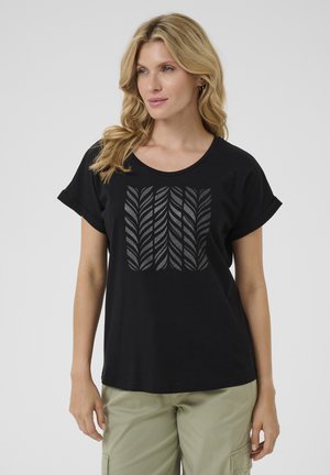 T-shirt en coton noir avec un col rond et des manches courtes retroussées, présentant un motif de feuilles grises sur le devant.