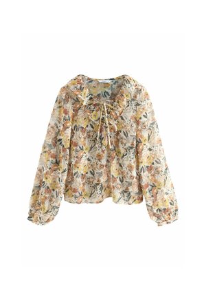 Blouse à manches longues fleurie avec des fleurs jaunes, orange et vertes, col à volants et détail noué à l'avant.