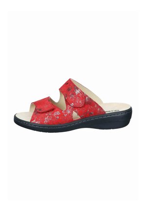 Red open-toe sandal with floral pattern, two adjustable Velcro straps, beige footbed, and black cushioned sole.