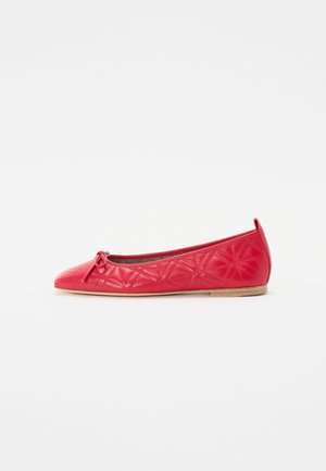 Red leather ballet flat with a pointed toe, featuring quilted star patterns and a decorative bow detail. Low rubber sole.