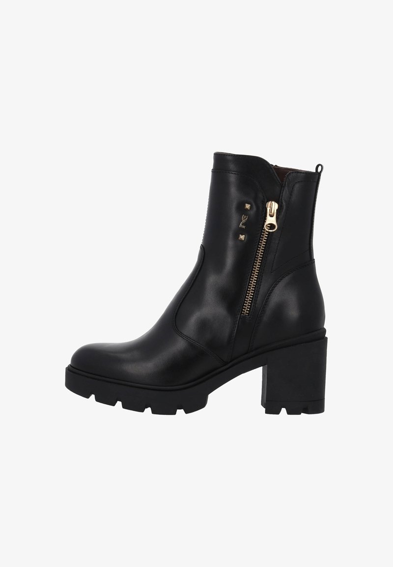 Black leather ankle boot featuring a zip closure, gold hardware, chunky block heel, and textured sole with a ridged pattern.