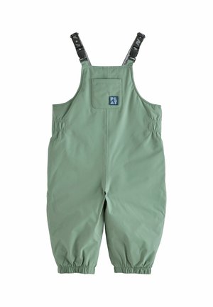 Salopette imperméable verte pour enfants avec bretelles noires réglables et poignets élastiques, avec une petite poche poitrine avec un écusson logo "PLAY".