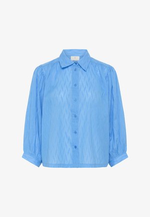 Helehall sinine lühikese varrukaga triiksärk laia kraega, tekstureeritud siksakmustriga ja volangvarrukatega. Valmistatud pehmest, kergest materjalist.