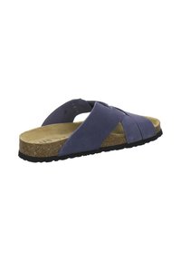 Blue suede slip-on sandal with crisscross straps, cork footbed, and black textured sole angled to show side and top view.