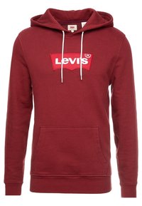 Felpa con cappuccio rossa in cotone con un laccio bianco. Presenta un grande logo bianco 'Levi's' su sfondo rosso e una tasca frontale.