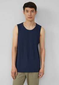 Navy blue sleeveless tank top, made from lightweight fabric, with a round neckline and a relaxed fit. Minimal detailing and no patterns.
