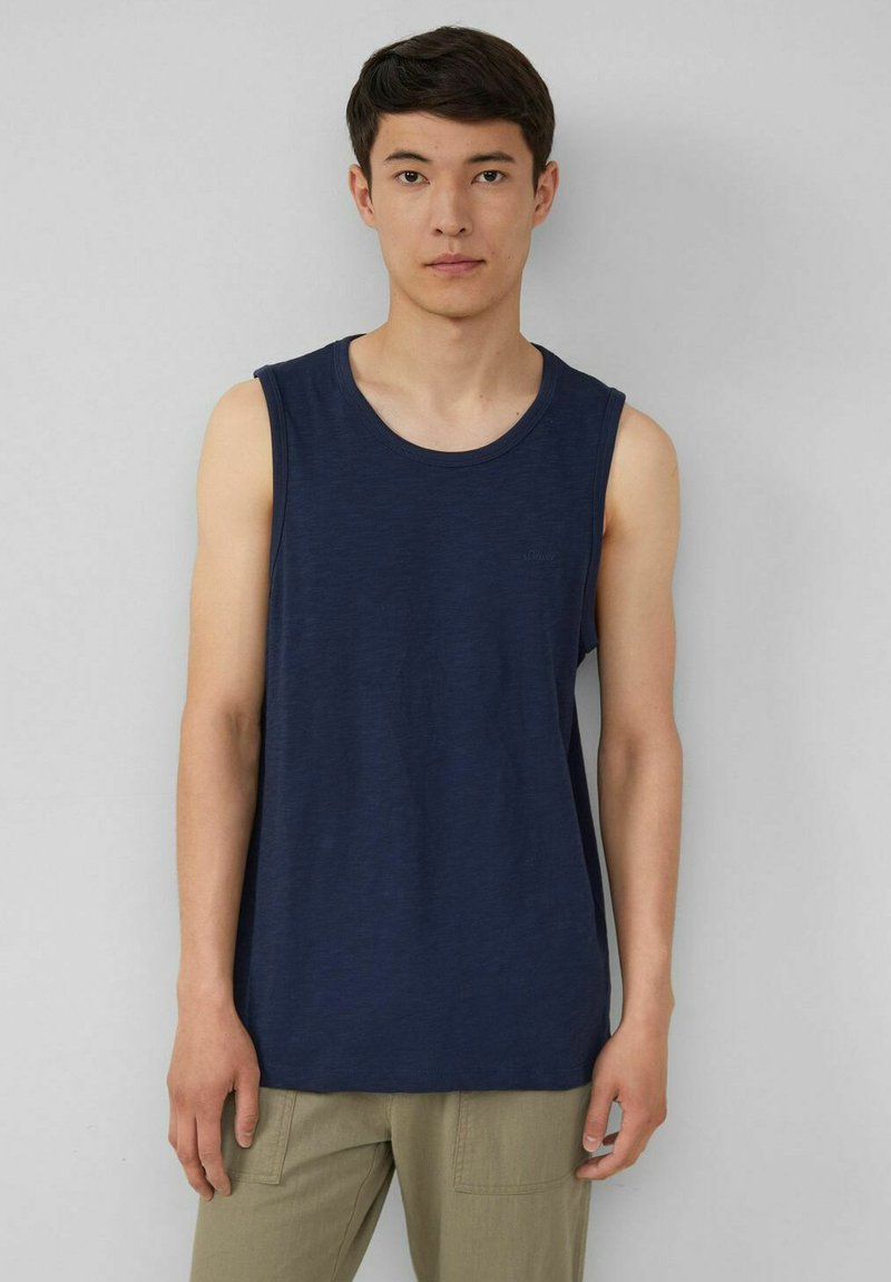Navy blue sleeveless tank top, made from lightweight fabric, with a round neckline and a relaxed fit. Minimal detailing and no patterns.