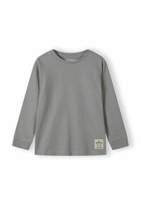 Camicia grigia in cotone a maniche lunghe con collo a girocollo e polsini a costine, con un piccolo etichetta rettangolare sul lato inferiore destro.