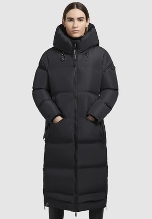 Black puffer coat with a long silhouette, oversized hood, zip closure, side pockets, and textured quilted pattern.