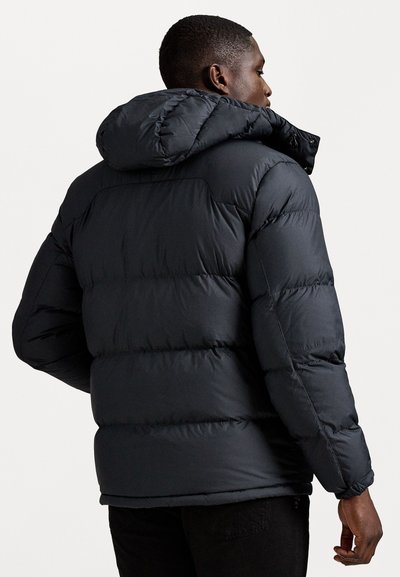 Black puffer jacket featuring a hood, quilted design, and a matte finish. Thick, insulated padding with elastic cuffs.