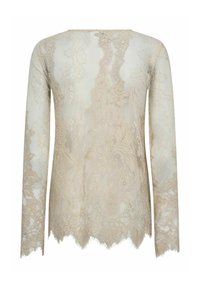 Top de manga larga de encaje en beige claro, con patrones florales, dobladillo en forma de ondas y textura ligeramente transparente. Diseño elegante y femenino.