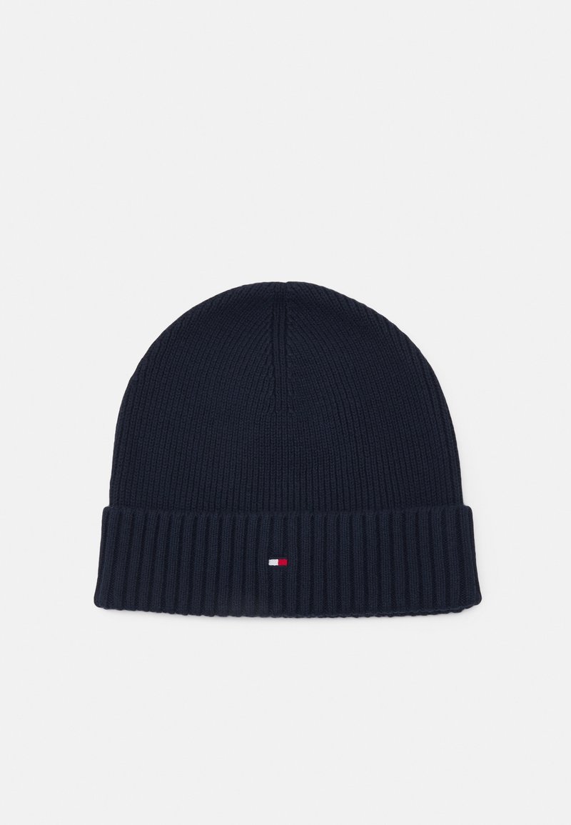 Bonnet côtelé bleu marine avec revers et petit logo rectangulaire rouge, blanc et bleu marine au centre à l'avant.