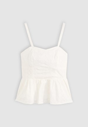Top peplum bianco con spalline sottili, motivo floreale texturizzato, corpetto aderente e fondo svasato. Realizzato in tessuto leggero.