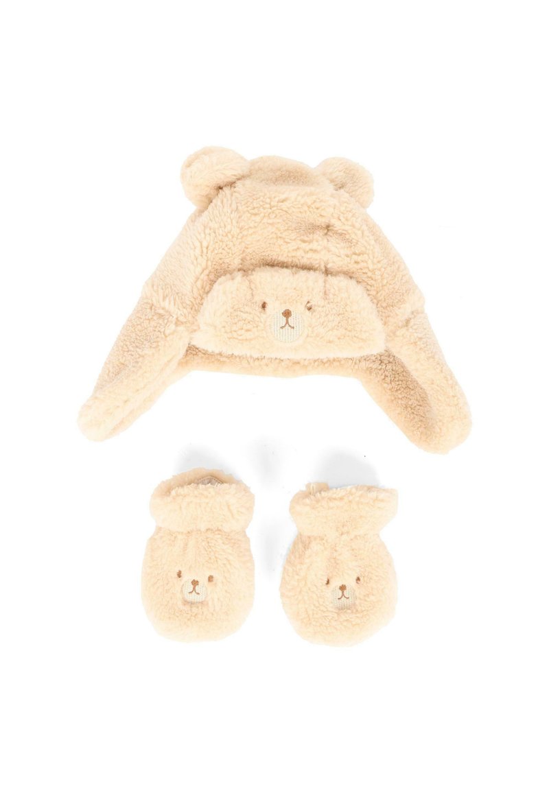 Cappello beige, soffice a tema orso con orecchie e dettagli del viso; abbinato a guanti coordinati con facce di orso. Tessuto morbido e testurizzato, design accogliente.