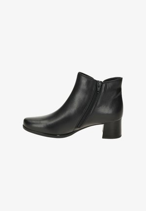 Bottine en cuir noir avec fermeture éclair sur le côté et petit talon carré, conçue pour la mode et le confort des femmes.