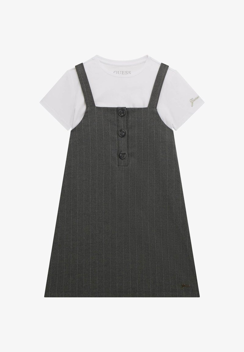 Gray pinstriped dress with straps, featuring three black buttons down the front and a white t-shirt underneath. Subtle logo detail on sleeve.