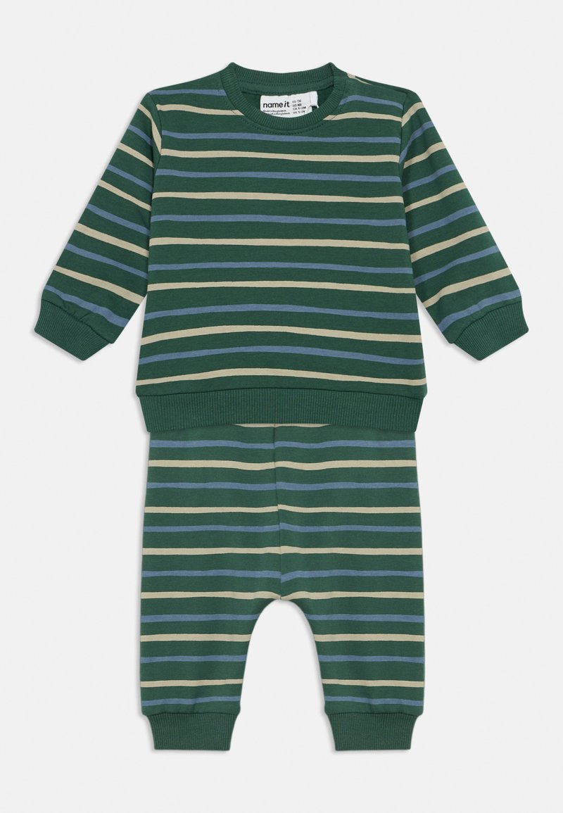 Green baby outfit with long-sleeve top and pants, featuring horizontal stripes in beige and blue and ribbed cuffs at sleeves and ankles.