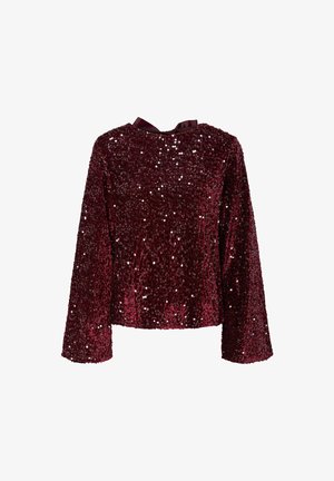 Top en sequins bourgogne avec des manches longues, un col rond et un détail en nœud en satin à l'arrière. Texture brillante avec des sequins sur toute la surface.