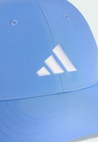 Blue cap made from smooth fabric features a stitched white adidas logo and neat stitching along the seams.