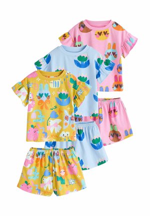 Four sets of children's pajamas featuring colorful animal and flower patterns. Materials: soft cotton; colors include yellow, pink, and blue.
