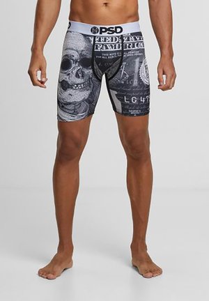 Sorte boxer briefs med et kranietryk, der har en grå elastik og et indviklet mønster af dollarsedler. Materialet ser blødt og strækbart ud.
