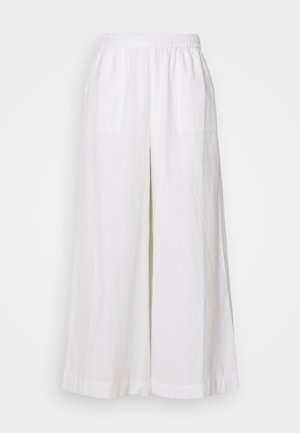 Bijele lanene hlače širokih nogavica s elastičnom gumom u struku, s dvije prednje džepa i laganom, teksturiranom tkaninom.