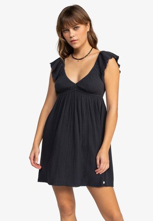 Black dress with a deep V-neck and ruffled sleeves. Made from textured fabric, it features a loose fit and a hemline above the knee.