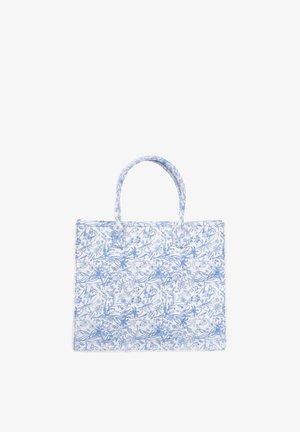 Heleline lilledega kott helesinises ja valges. Valmistatud vastupidavast kangast, millel on kaks käepidet ja struktureeritud ristkülikukujuline kuju.