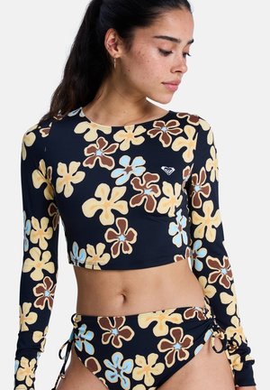 Langärmliges Crop-Top und passender Bikini in Dunkelblau mit übergroßem gelbem, braunem und hellblauem Blumenmuster. Mit verstellbaren Bändern.