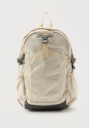 Beige Columbia rygsæk med front spænde rem, netlommer i siderne og polstret bund, designet til udendørs eller afslappet brug.