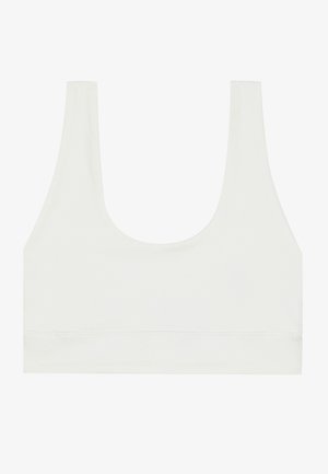 White bra top with a scoop neckline, wide straps, and a smooth, stretchy fabric. Features a simple design and an elastic underband.