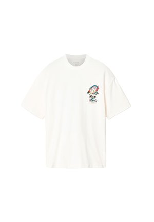 White oversized t-shirt with a small colorful dragon, skull, and floral embroidery on the left chest.
