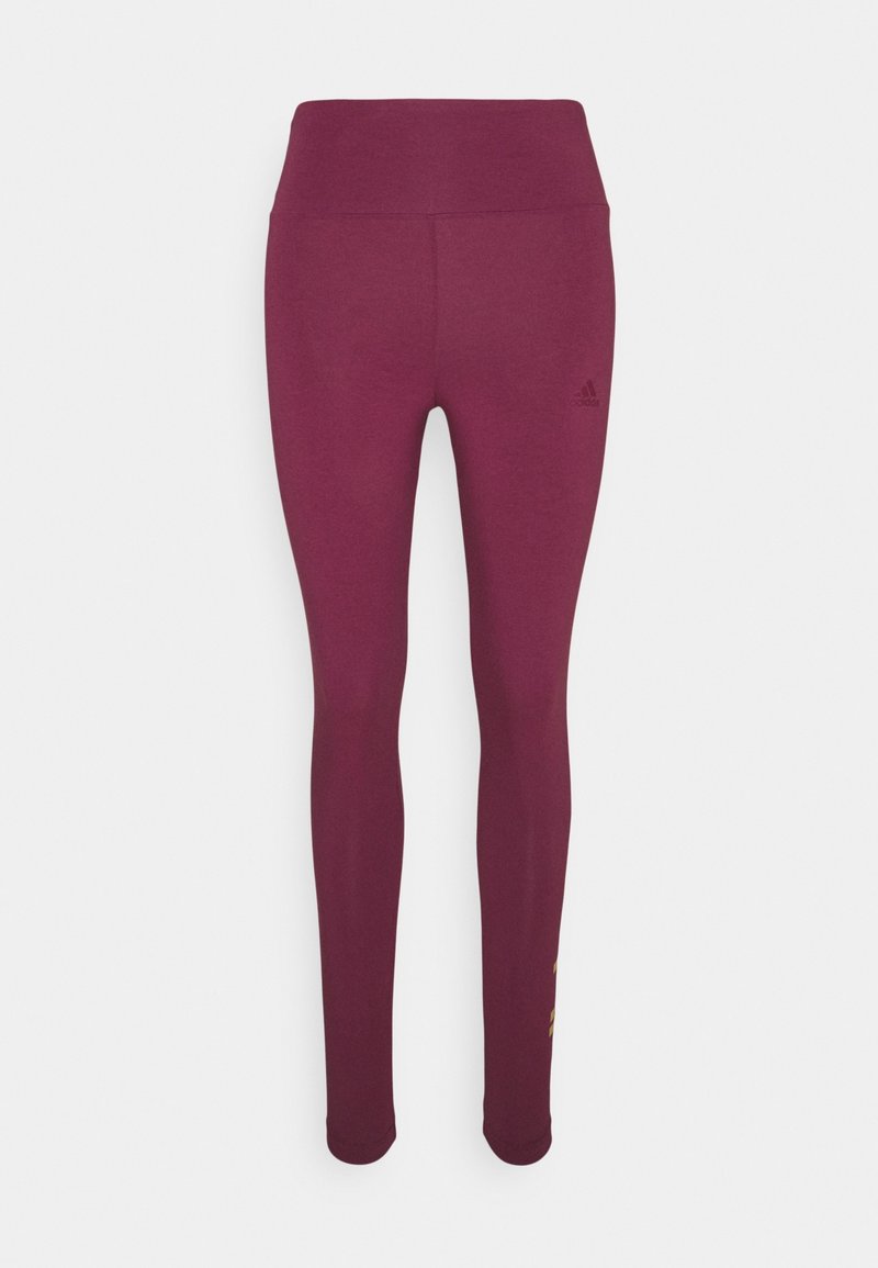 Burgundy leggings made of stretchy fabric, featuring a high waistband and subtle logo on the hip, with a smooth texture and form-fitting design.